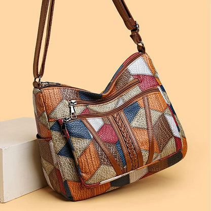 SCARLETT | BOLSO DE MANO CON MOSAICO ATEMPORAL