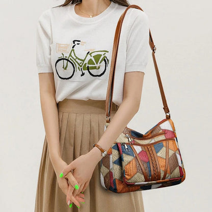 SCARLETT | BOLSO DE MANO CON MOSAICO ATEMPORAL